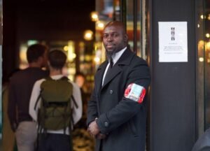 Black man in a coat | Dynamiseducation.co.uk