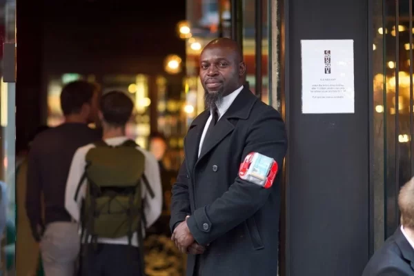 Black man in a coat | Dynamiseducation.co.uk